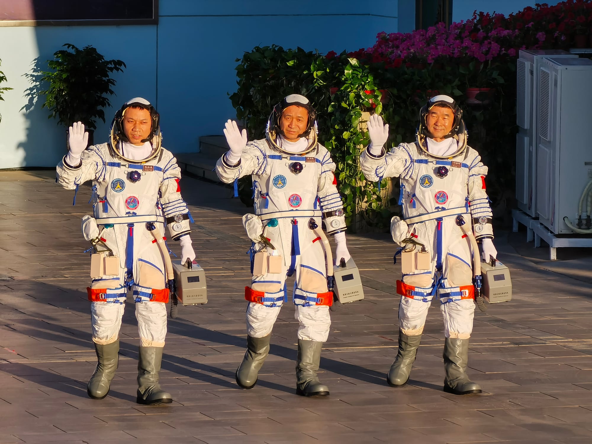 The crew of Shenzhou-12 during their walkout before launch, (from left to right) Tang Hongbo, Nie Haisheng, and Liu Boming. ©China Manned Space Agency