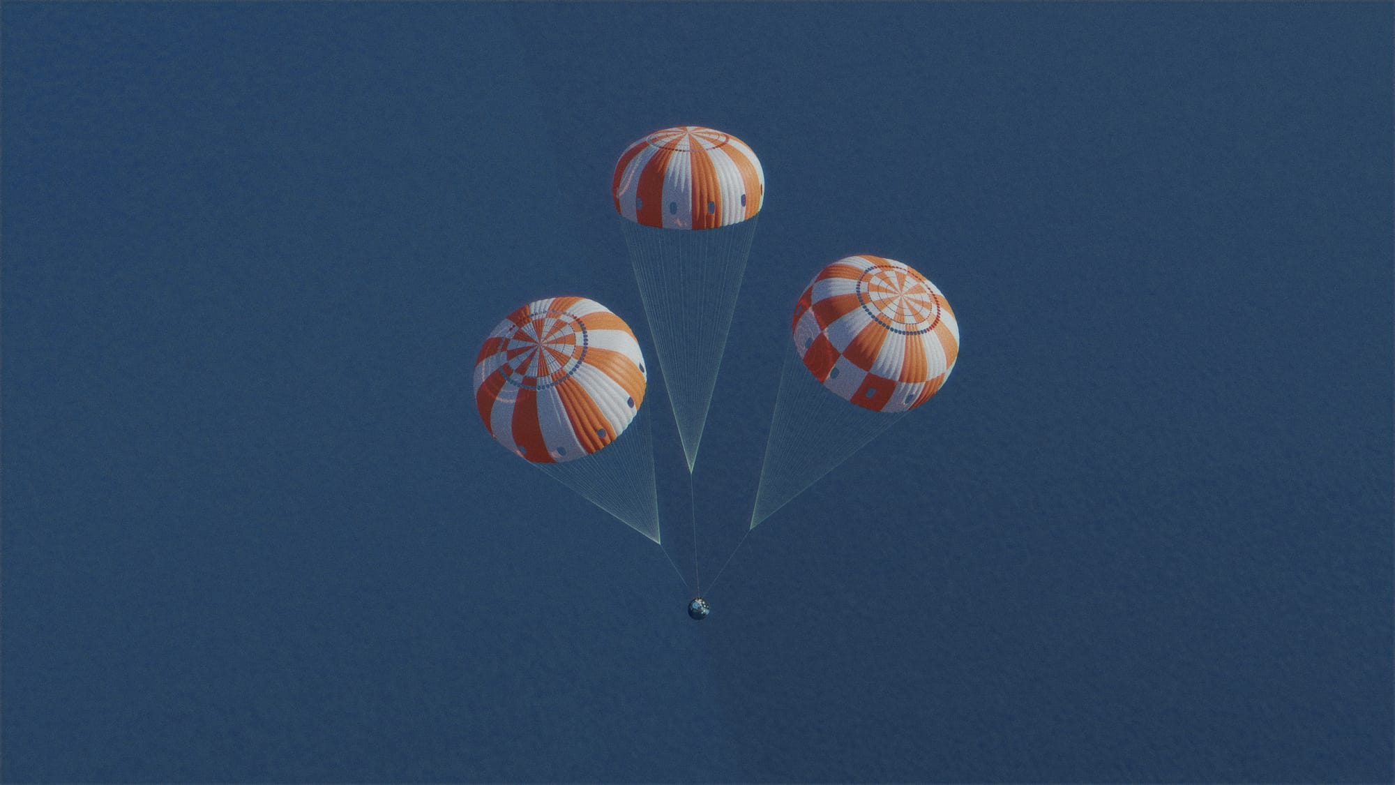 A render of an Orion spacecraft returning to Earth under a parachute after atmospheric re-entry. ©NASA