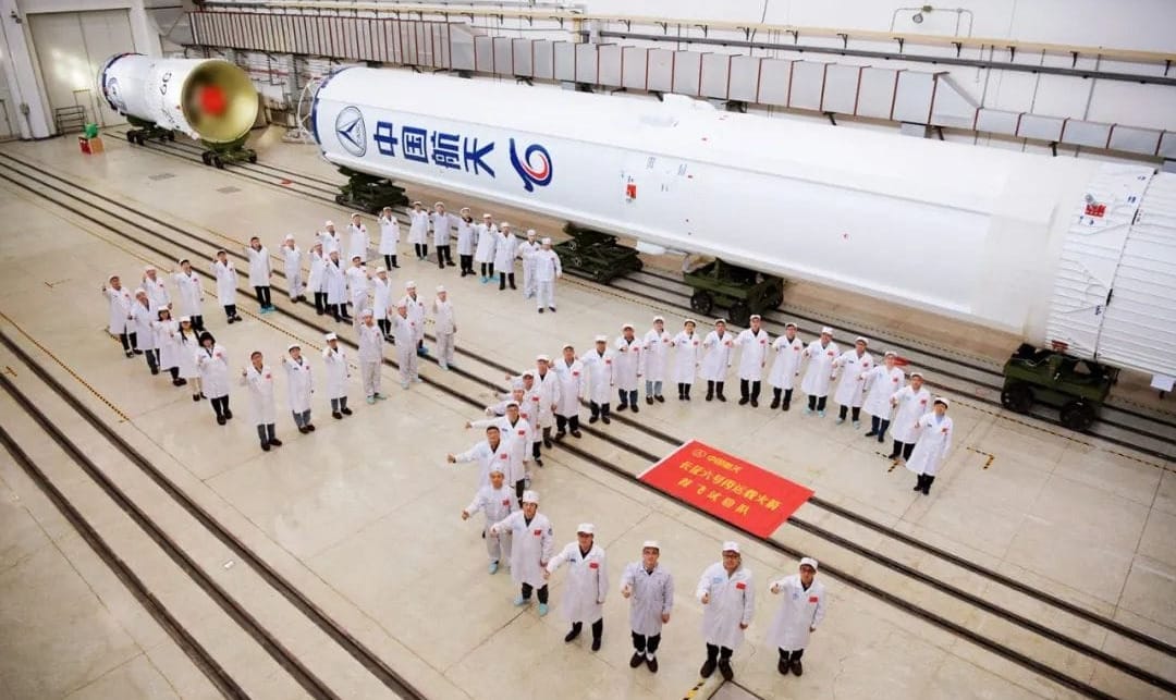 The Long March 6C's first and second stages during integration with engineers from the Shanghai Academy of Spaceflight Technology.